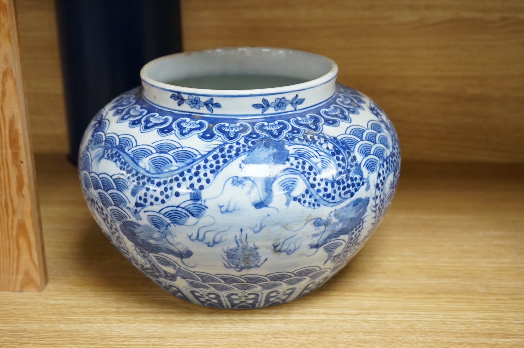 A Chinese blue and white ‘dragon’ bowl, 19cm high